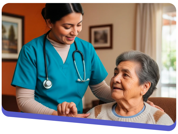 Caregiver in teal scrubs with a stethoscope sits beside an elderly woman at home, offering support and reassurance.