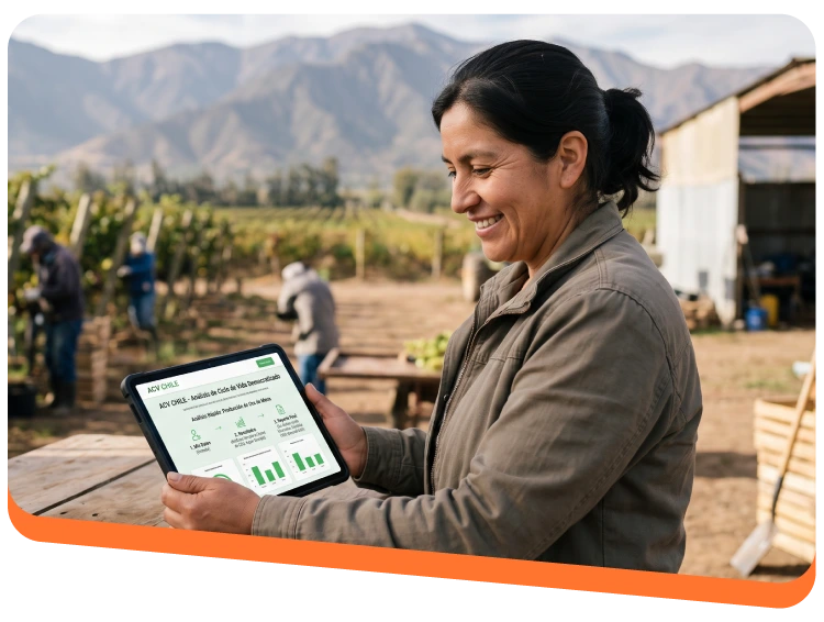 Smiling woman in a field holds a tablet displaying a data dashboard in a vineyard with mountains in the background.